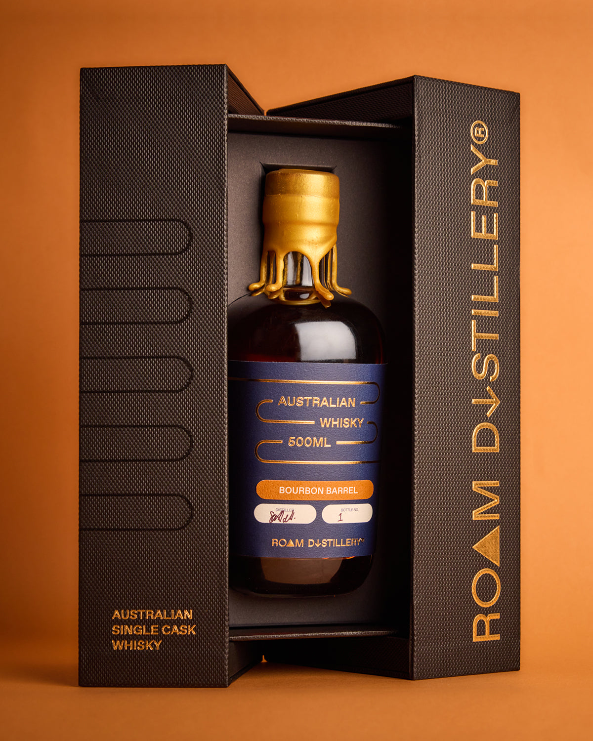 Bottle of Roam Distillery Australian Single Cask Whisky in a black box on an orange background